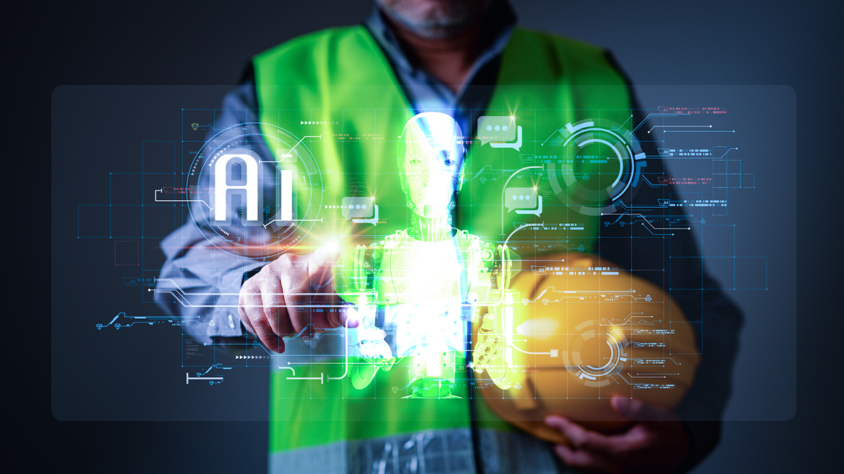 Engineer Standing in the work site and using technology artificial intelligence or ai with laptop and tablet for business, digital, and science, AI helps speed up human work.